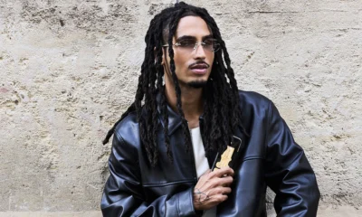 Matuê Rabanne: o rapper de jaqueta de couro segura o frasco do perfume 1 Million Black