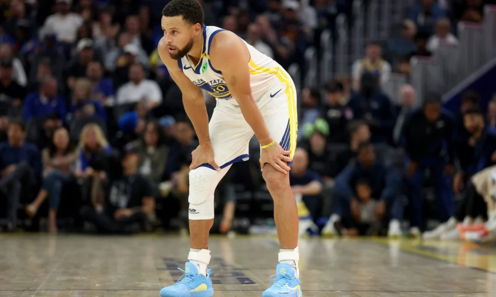 Stephen Curry com uniforme do Golden State Warriors em quadra na temporada 2026/27