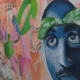 Grafite com o rosto de Tupac Shakur e a frase Thug Life 2Pac em muro do Rio de Janeiro